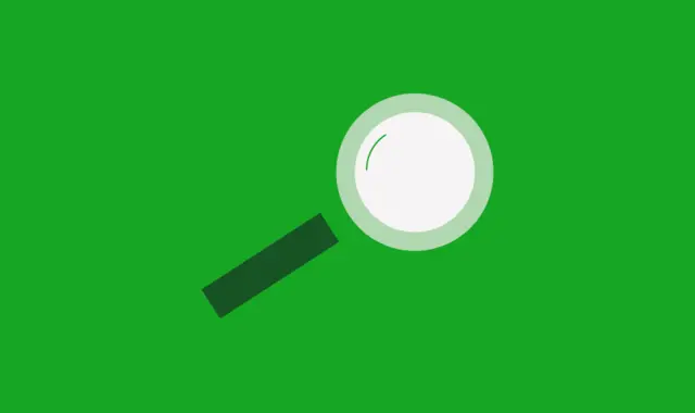 Förstoringsglas på grön bakgrund