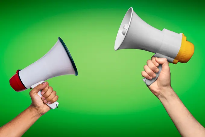 Megaphones on a green background